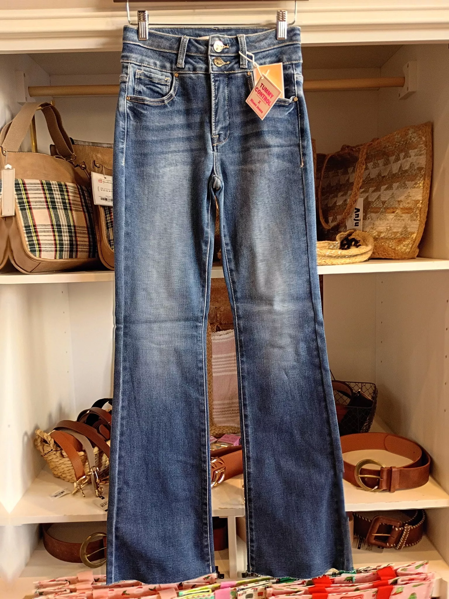 Risen: High Rise Boot Cut Medium Wash